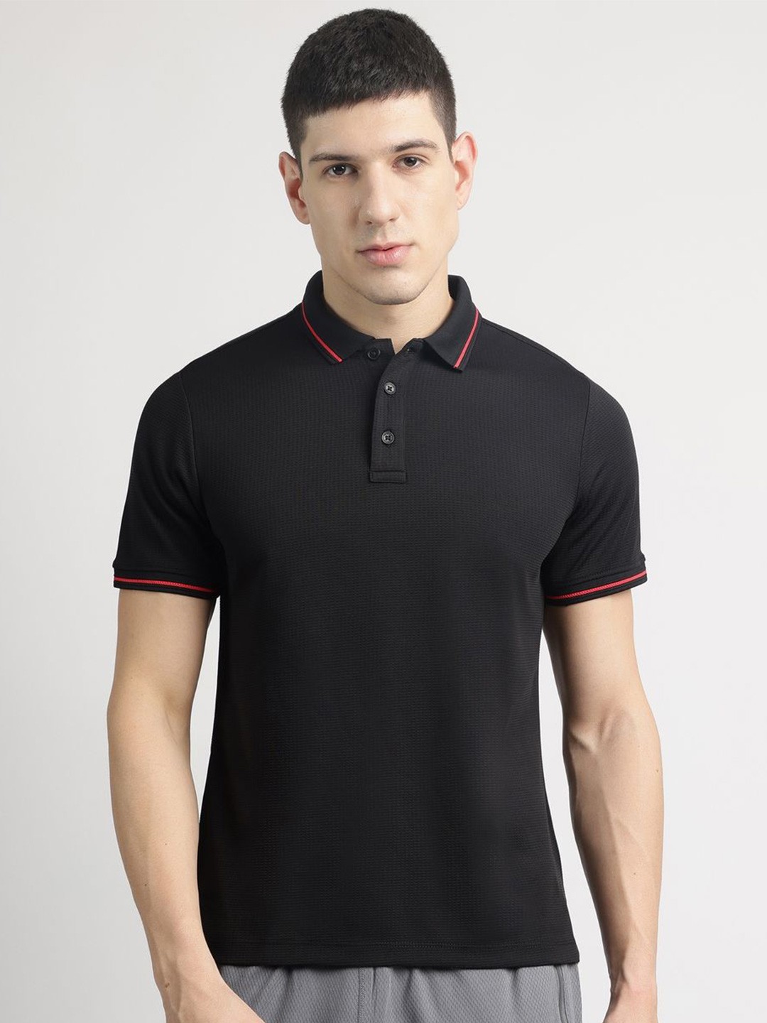 

Reebok Men Self Design Polo Collar T-shirt, Black