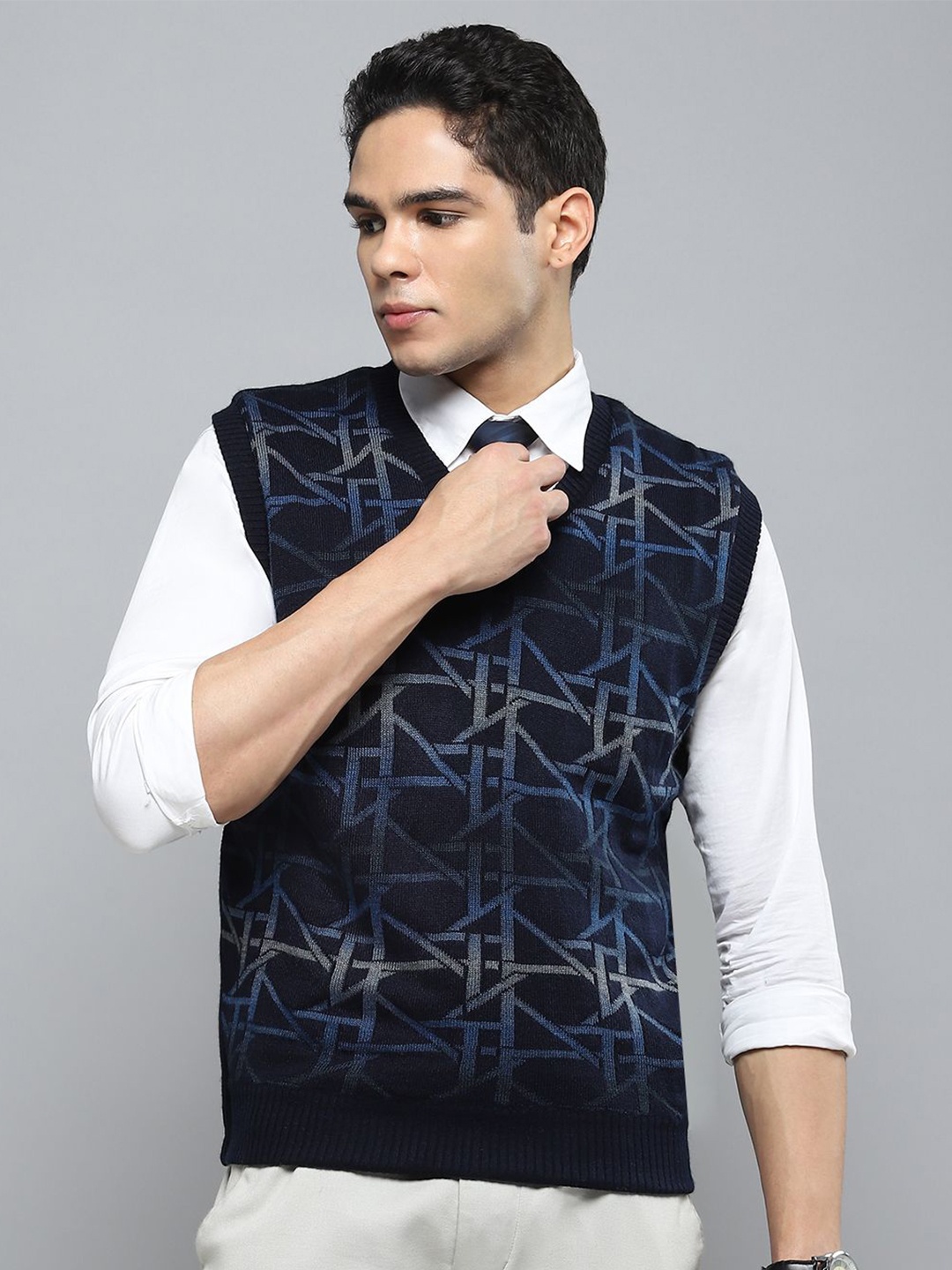 

Cloak & Decker Men Self Design V-Neck Full Sleeve Woollen Sweater Vest, Navy blue