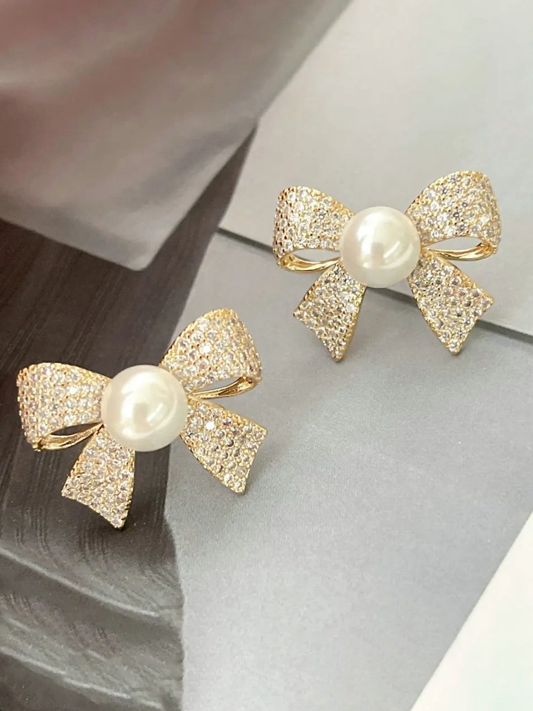 

Celestique Gold-Plated Zircon Studded Bow Shaped Studs