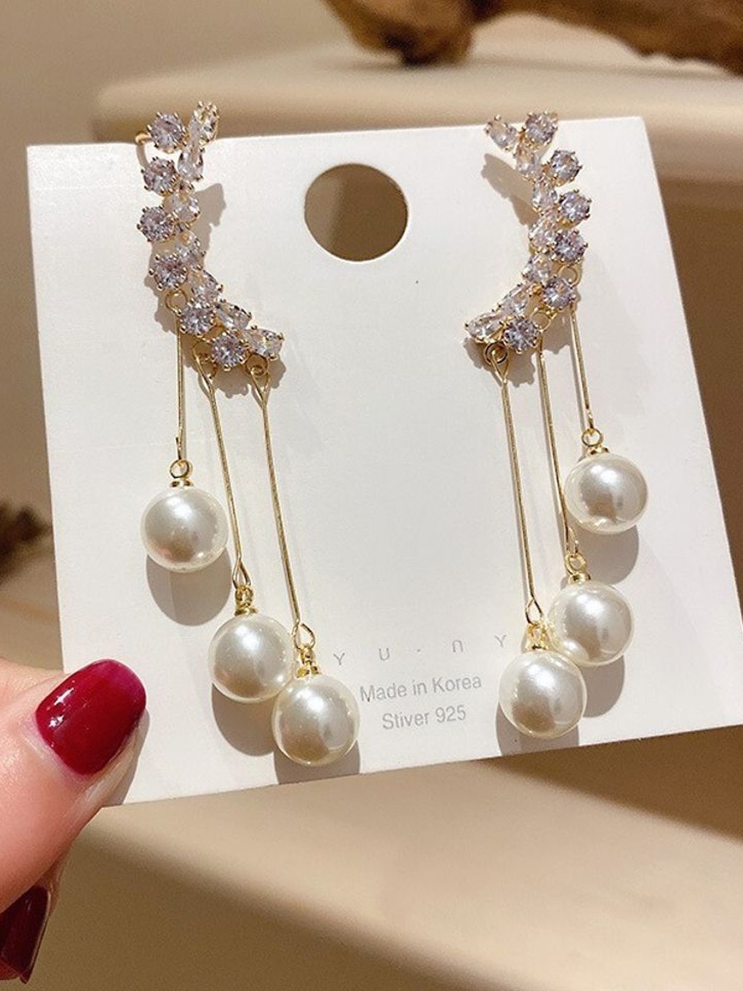 

Celestique Stainless Steel Gold Plated Zircon Studded Contemporary Drop Earrings