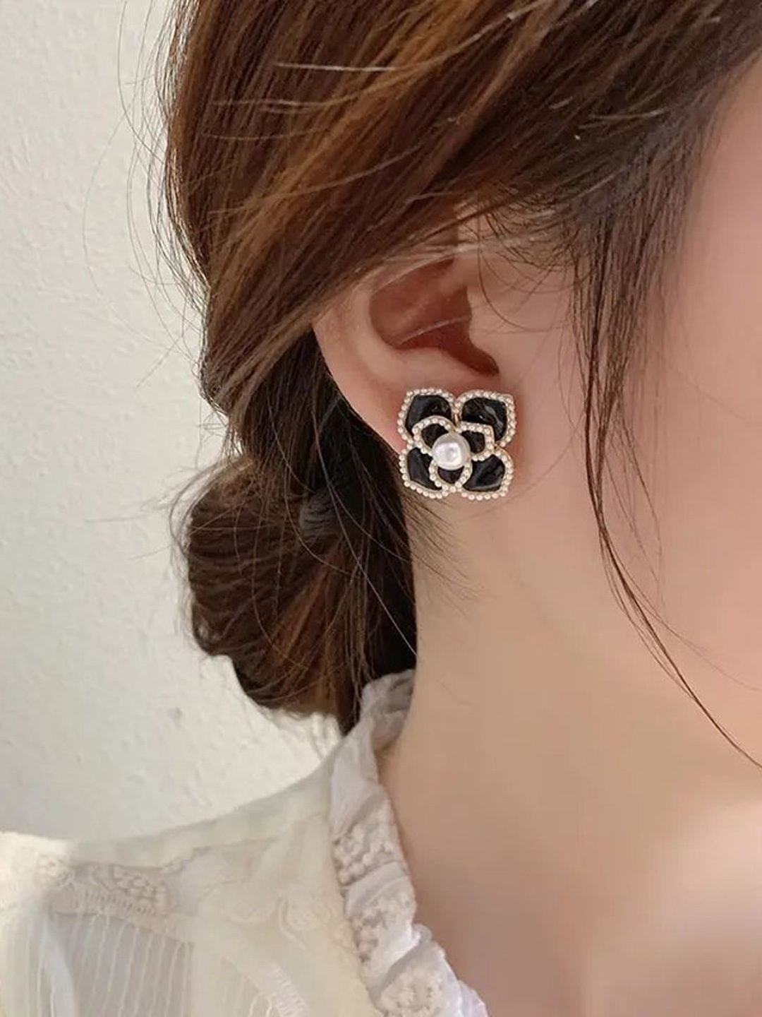

Celestique Pearls Studded Floral Shaped Studs, Black