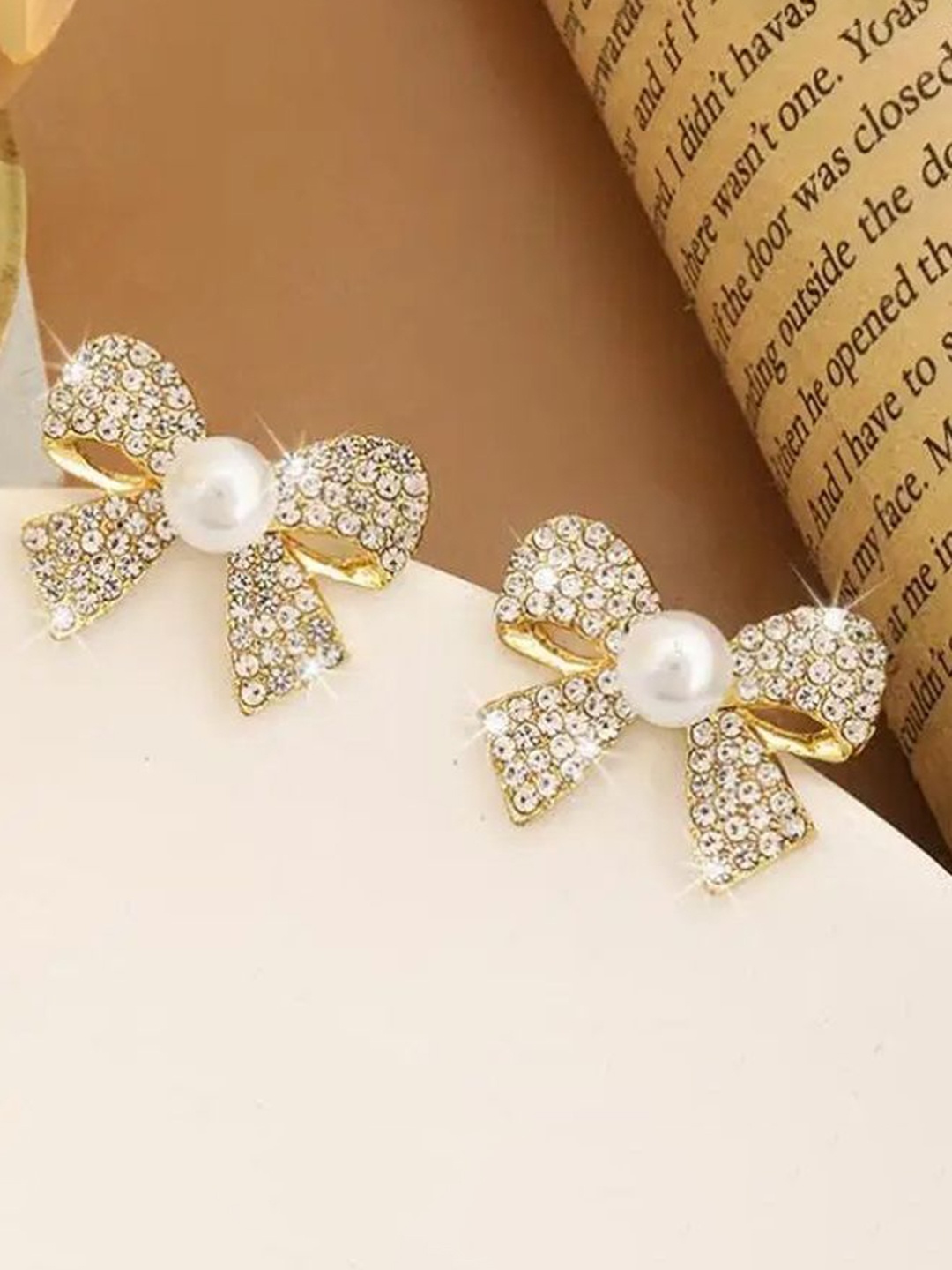 

Celestique Gold-Plated Stone Studded Bow Shaped Studs