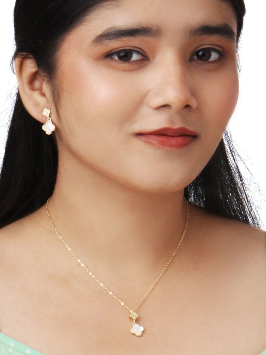 

Kord Store Gold-Plated American Diamond Studded Pendant and Earrings