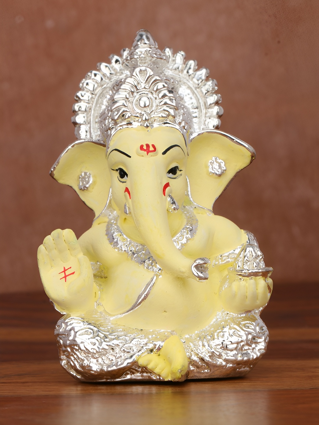 

Funku Fashion Yellow & Silver Toned Lord Ganesha Idol Showpiece