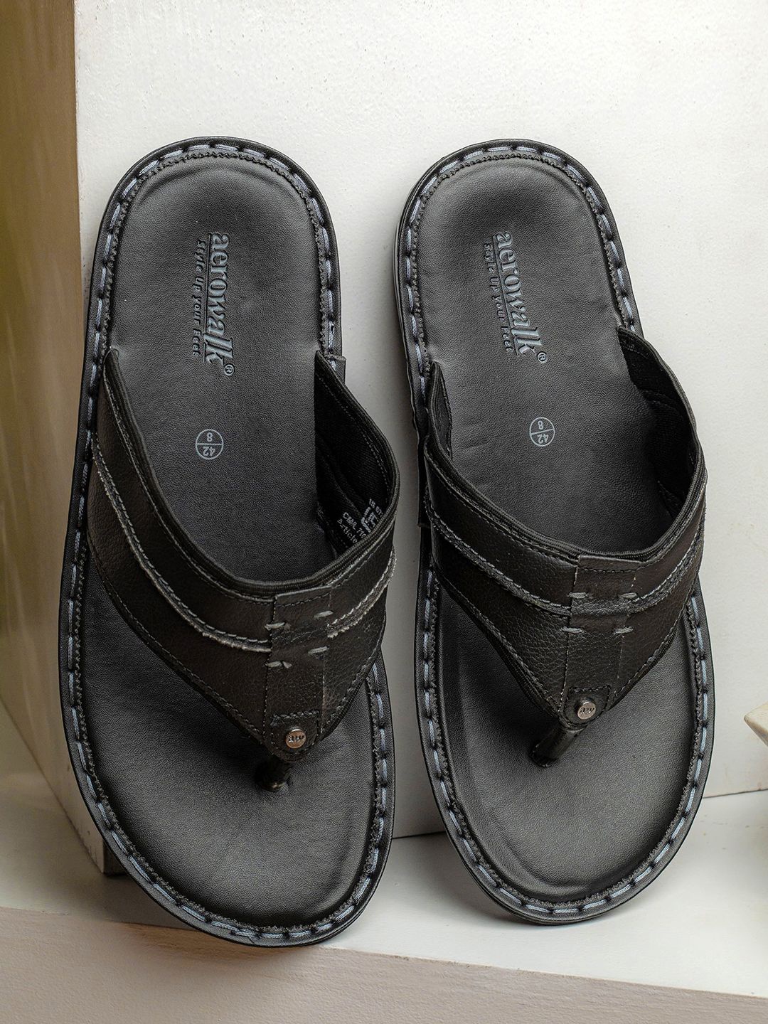 

Aerowalk Men Solid Slip-On Flip Flops, Black
