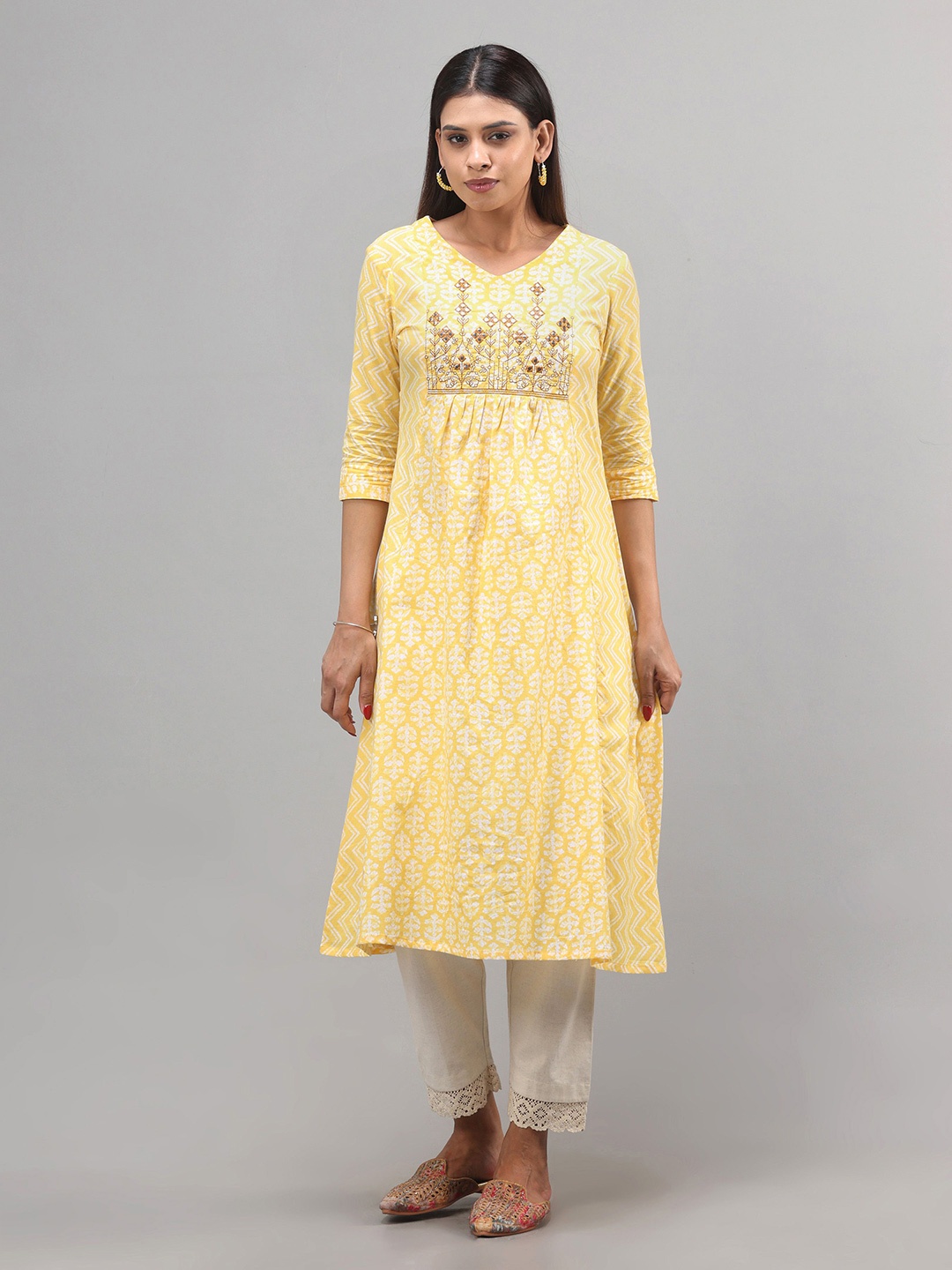 

Vismay Women Floral Printed With Embroidered Cotton A-Line Kurta, Yellow