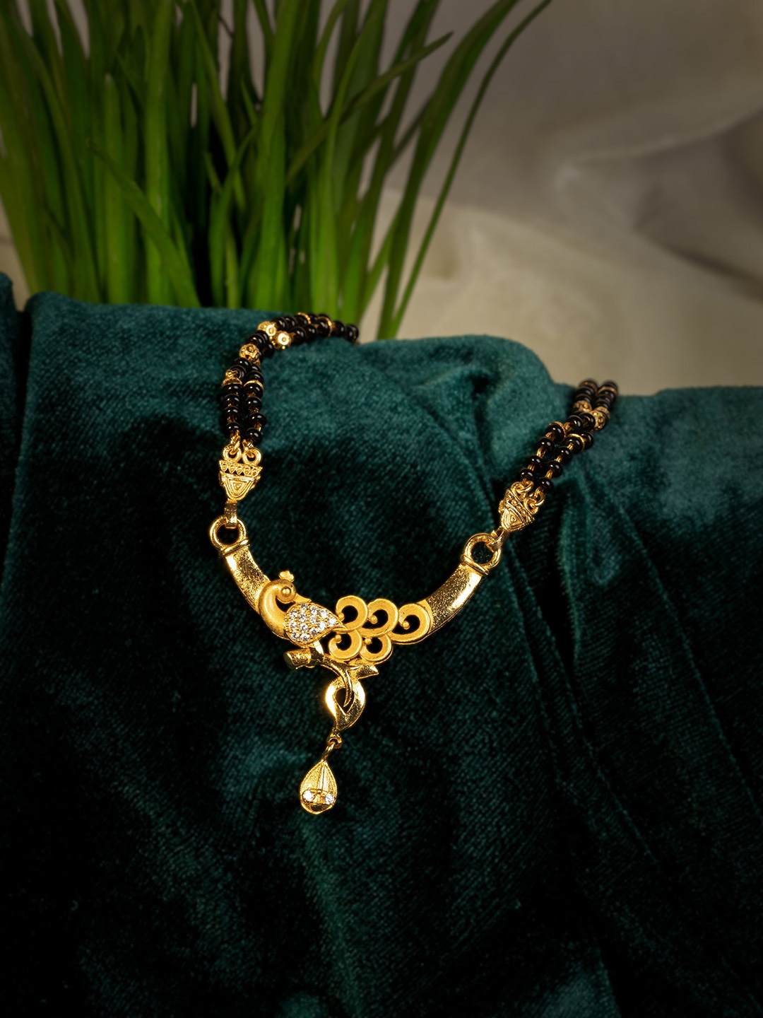 

GOLD CASH Gold-Plated Stone Studded and Beaded Peacock Design Mangalsutra