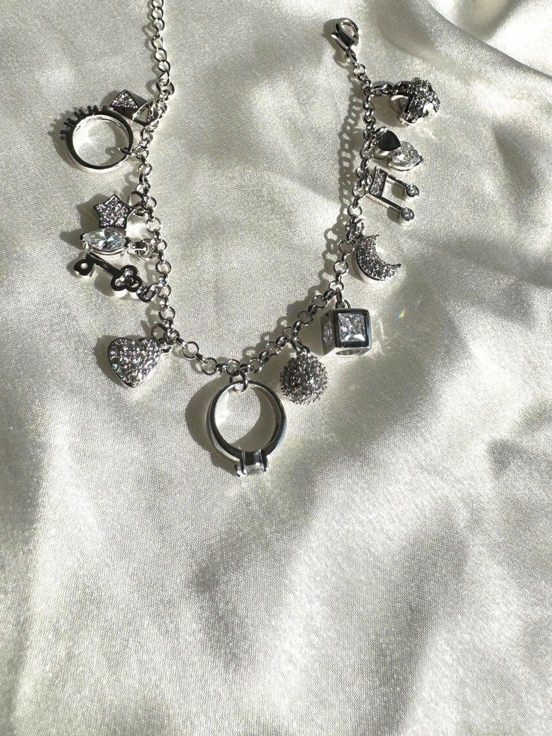 

The Jewellery Tale Men Silver-Plated Stone Studded Twelve Symbol Charms Bracelet