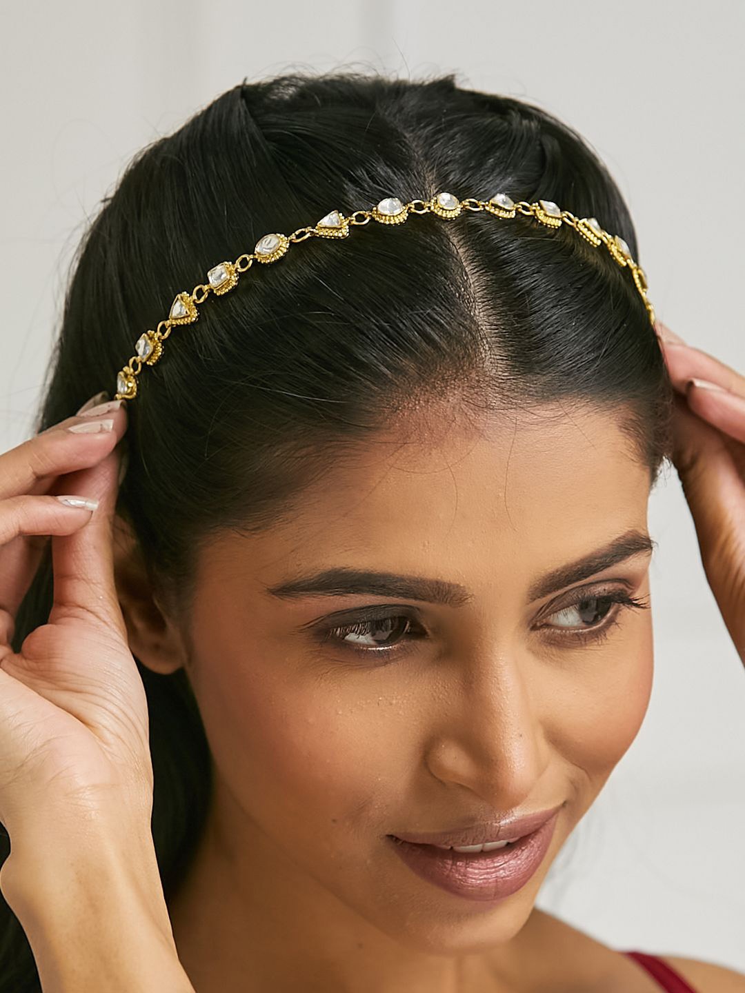 

Yinara Gold-Plated Crystal & Pearls Studded Matha Patti Head Jewellery
