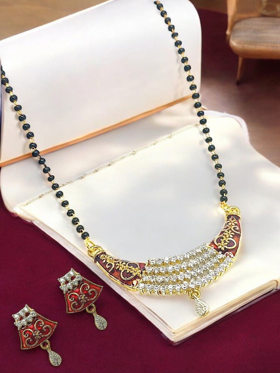 

FEMMIBELLA Gold-Plated Artificial Stones and Beads Zirconia Studded Mangalsutra Set