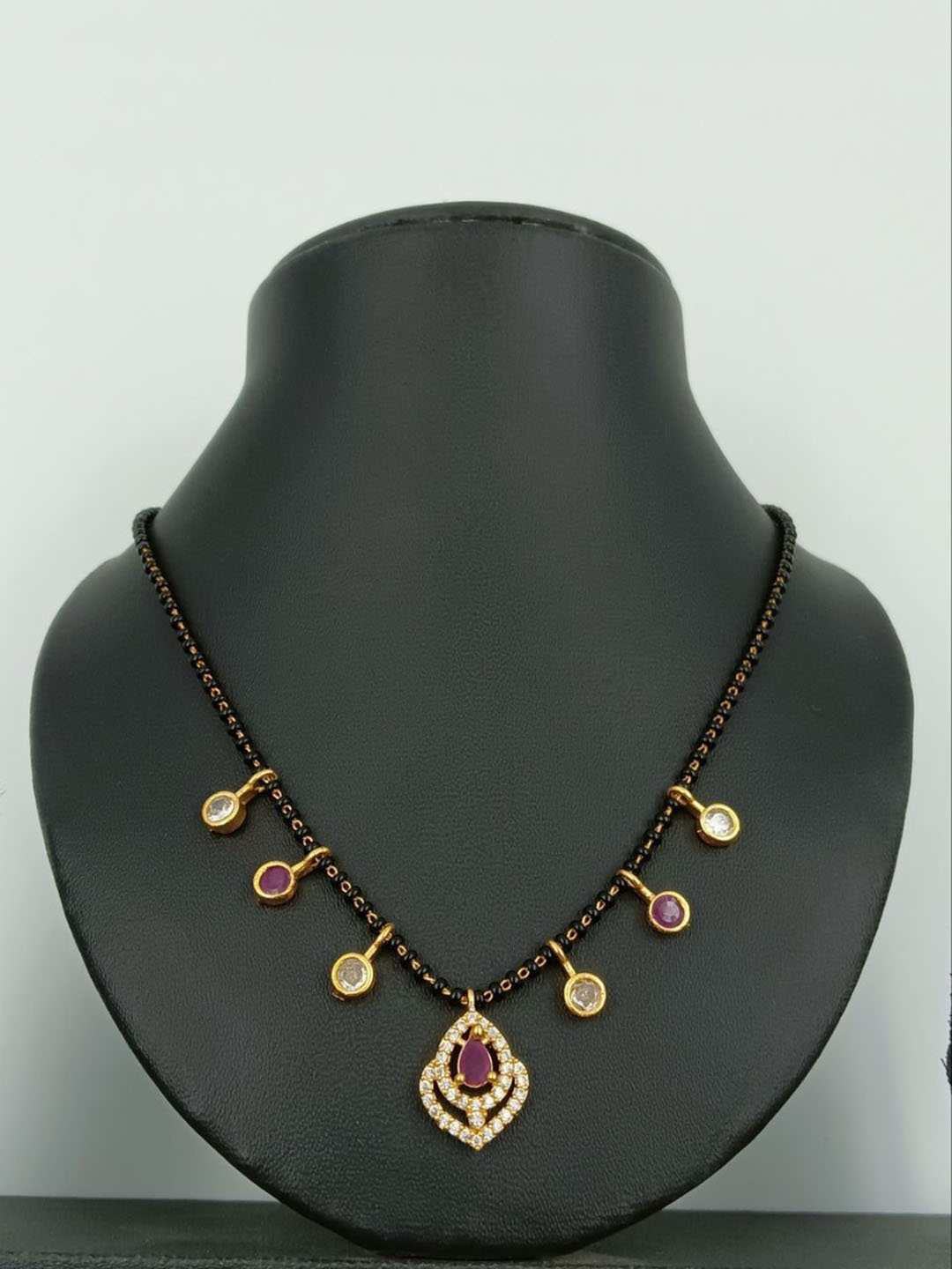 

Harikrupa Gold-Plated Artificial Stones and Beads Mangalsutra