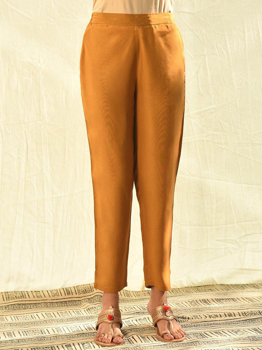 

JAYPORE Women Cotton Relaxed Pleated Trousers, Mustard