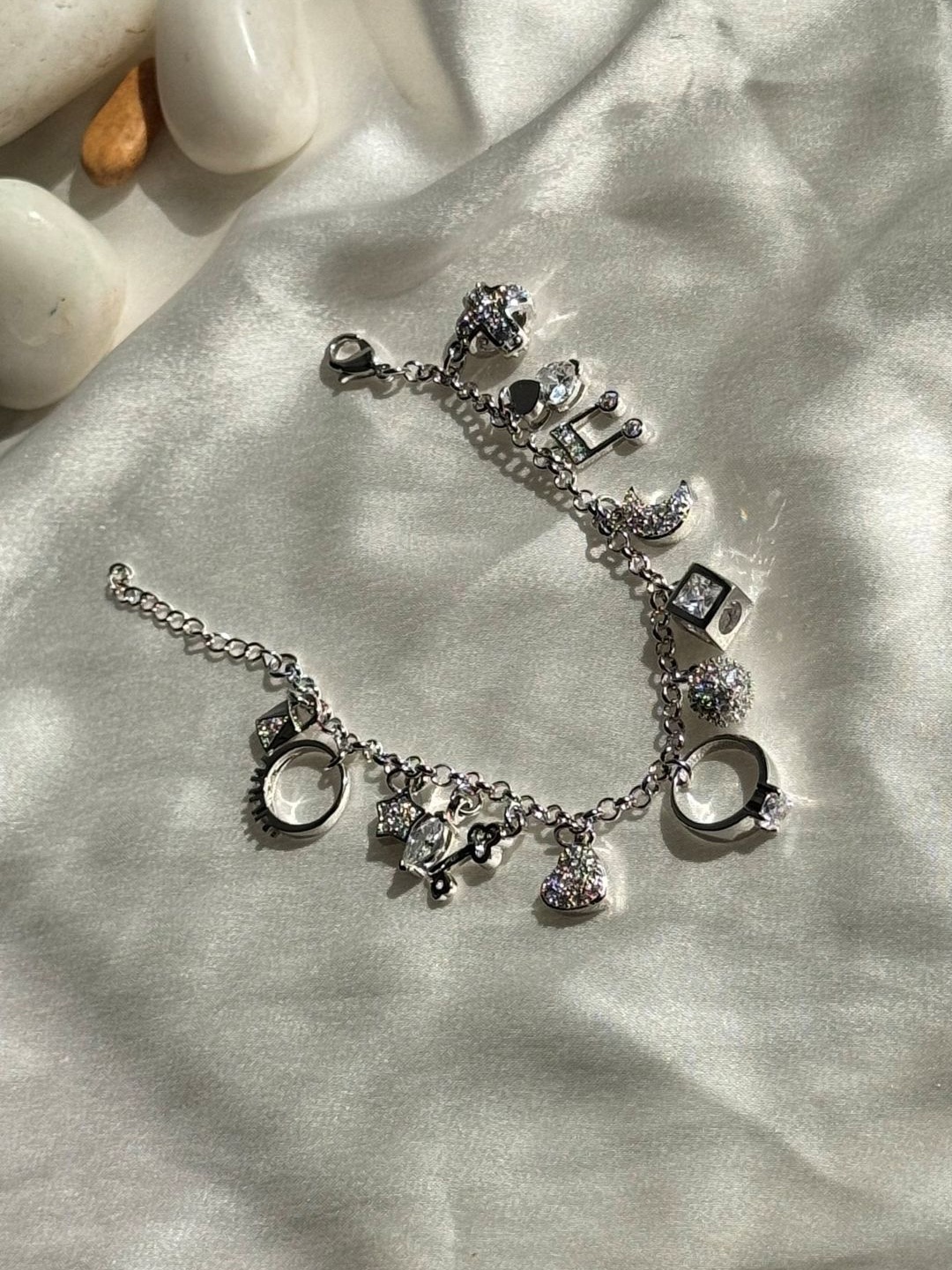 

The Jewellery Tale Silver-Plated Stone Studded Twelve Symbol Charms Bracelet