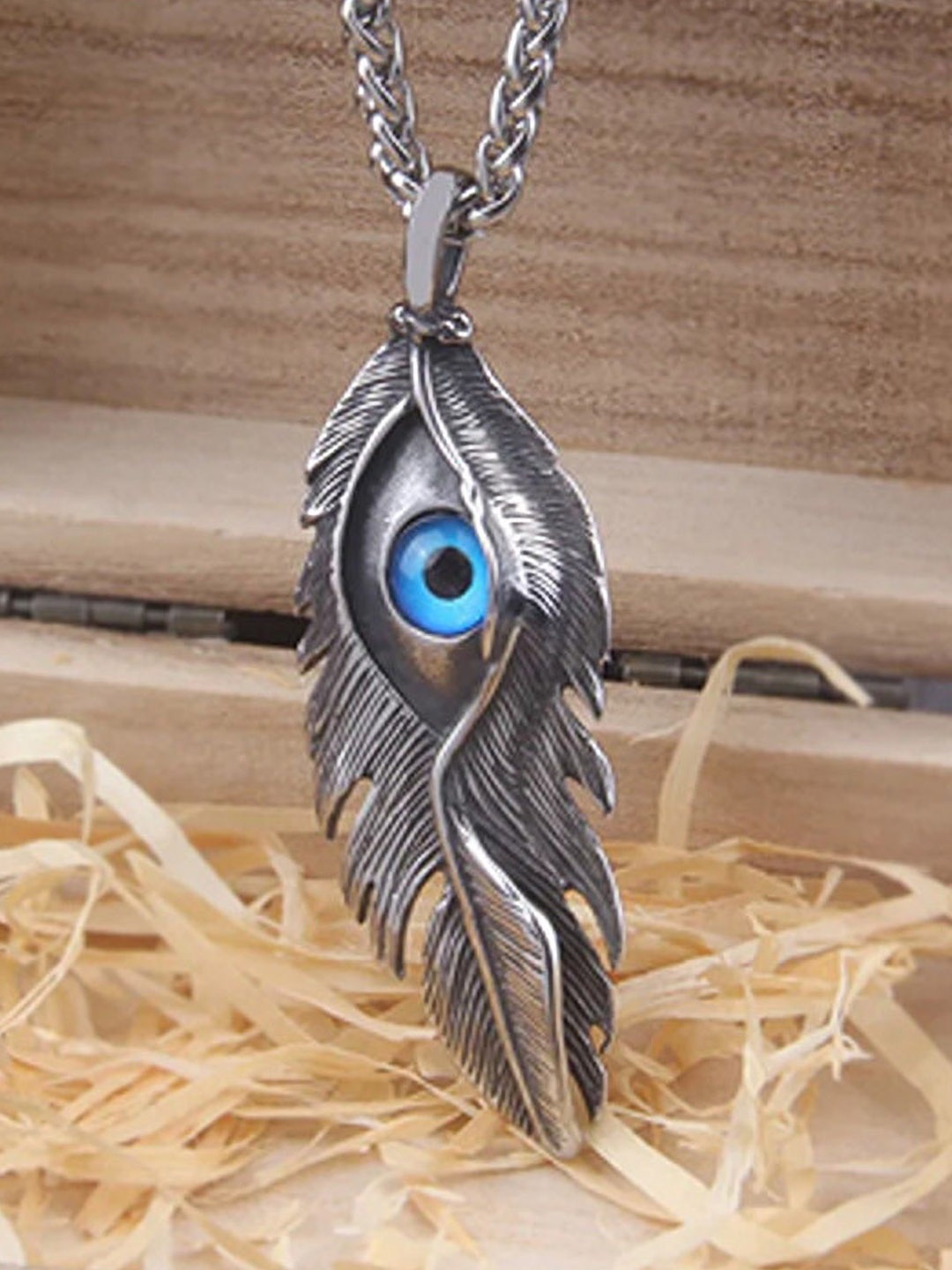 

Lila Stainless Steel Oval Devil Eyes Feather Pendant with Chain, Silver