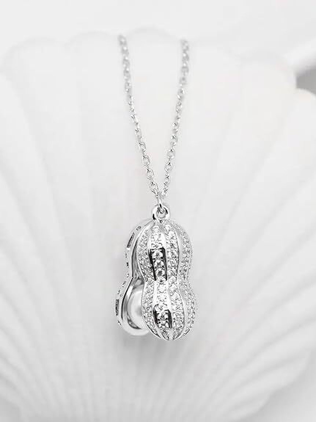 

Lila Unisex Stainless Steel Cubic Zirconia Studded Peanut Shape Pendant With Chain, Silver