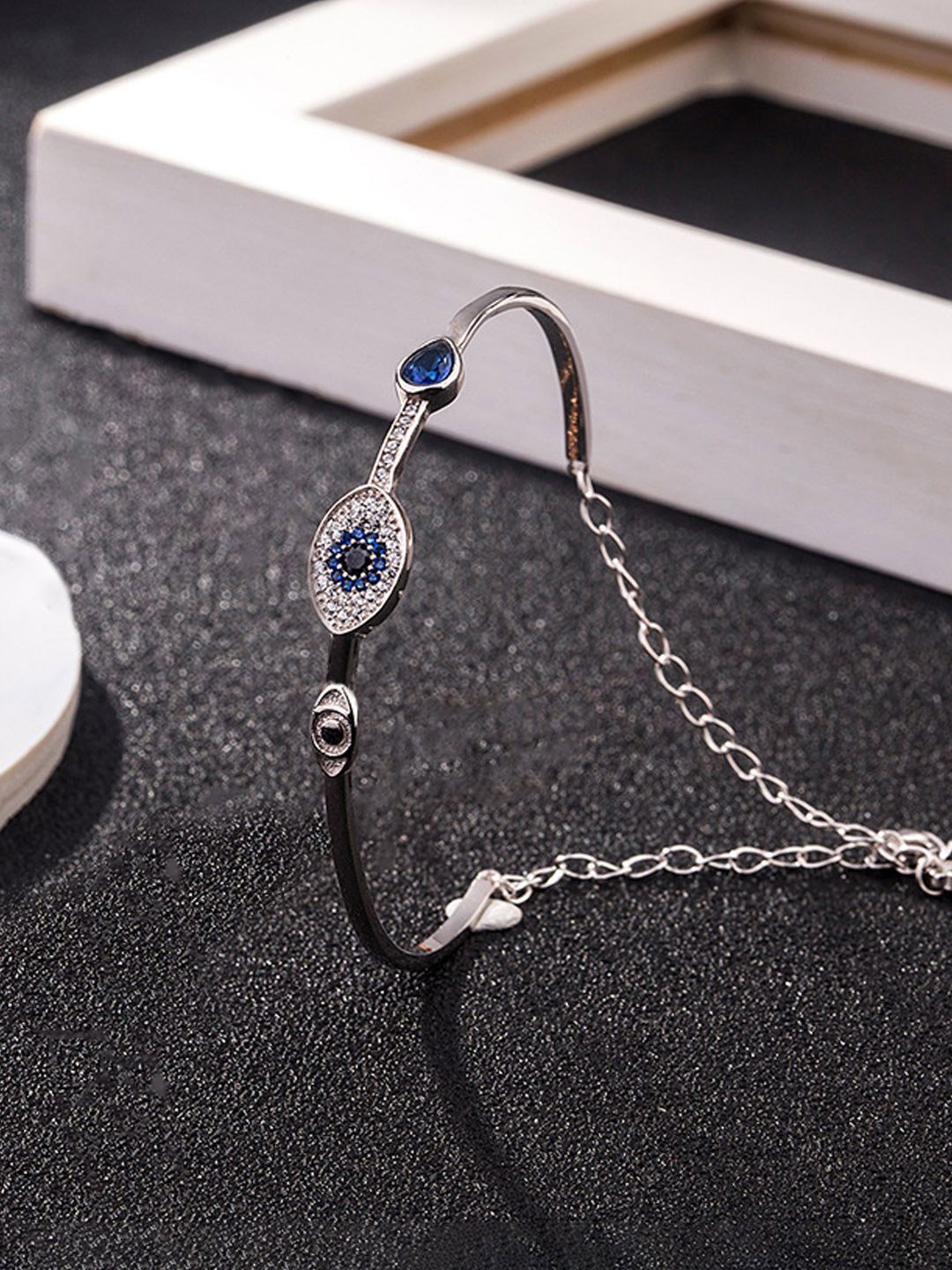 

Designs & You Silver-Plated American Diamond Studded Evil Eye Bangle-Style Bracelet
