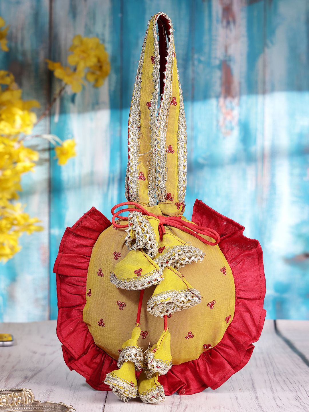

Dhrohar Floral Embroidered Tasselled Potli, Yellow