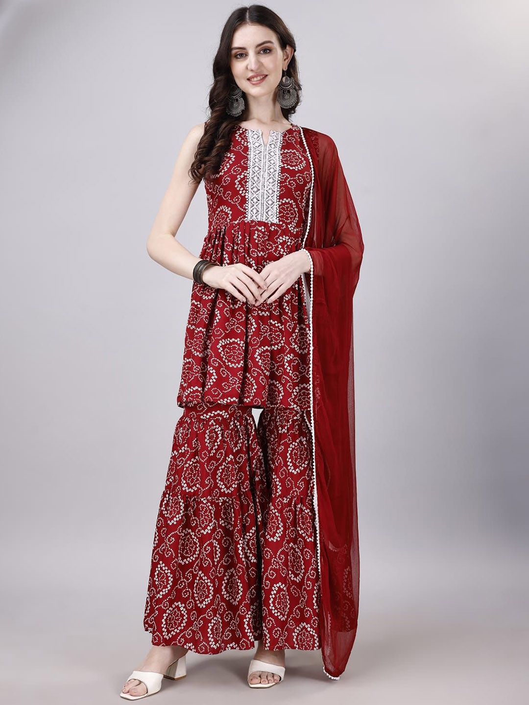 

KALINI Bandhani Printed Gotta Patti Sleeveless A-Line Kurti With Sharara & Dupatta, Maroon