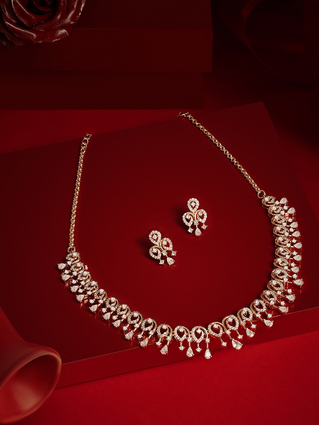 

Zaveri Pearls Rose Gold-Plated Cubic Zirconia Stone Studded Jewellery Set