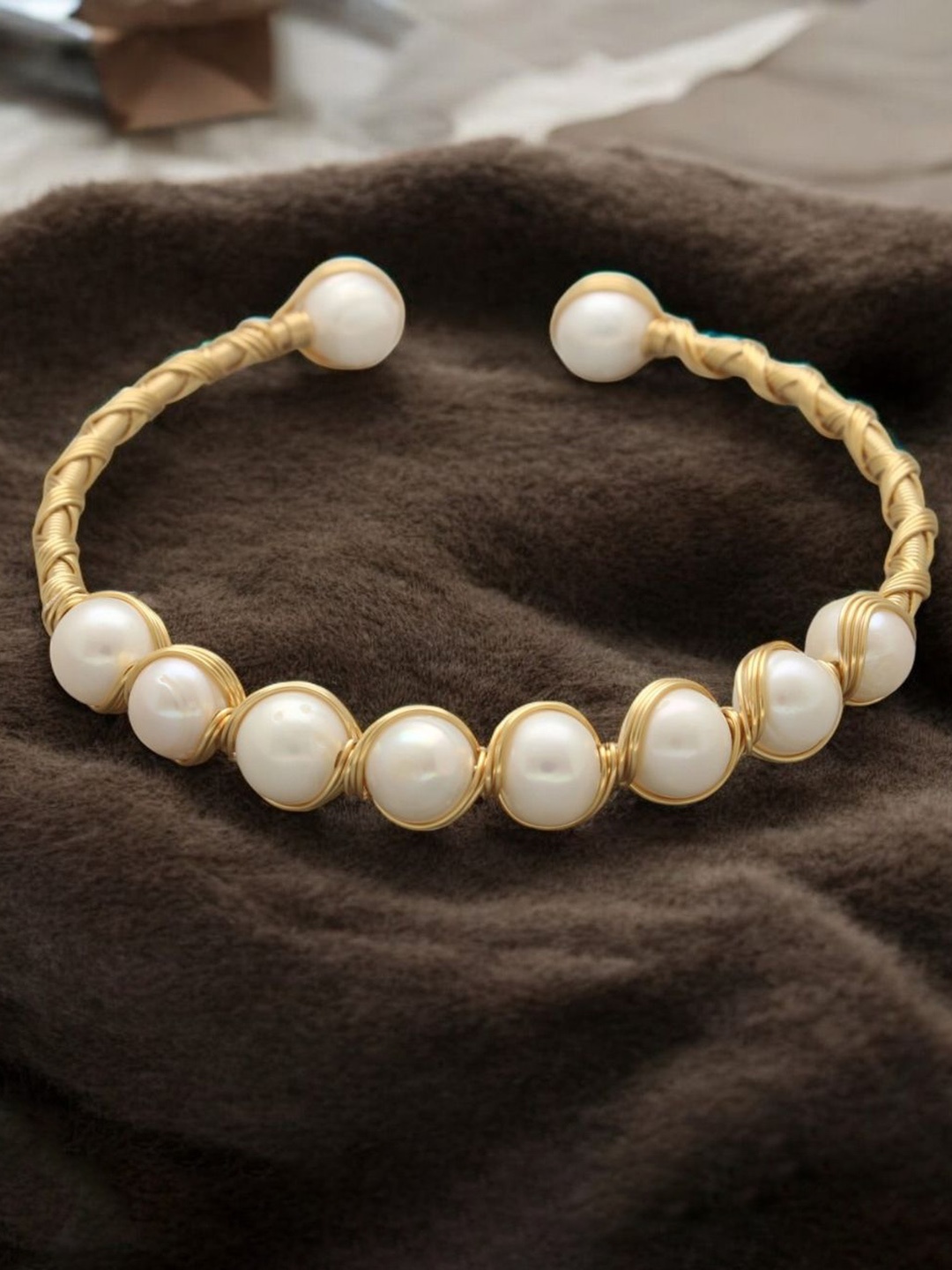 

Sri Jagdamba Pearls Dealer Gold Plated Pearls Charm Bracelet