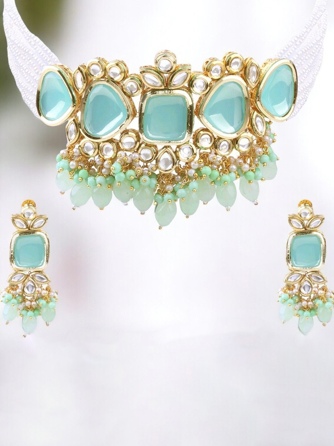 

Knigght Angel Jewels Gold-Plated Kundan Stone Studded & Beaded Jewellery Set