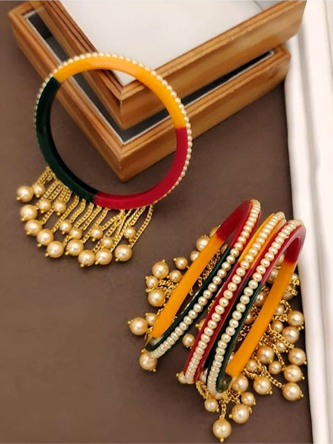 

Zindura Pack Of 4 Gold Plated Pearls Beaded Studded Bangles