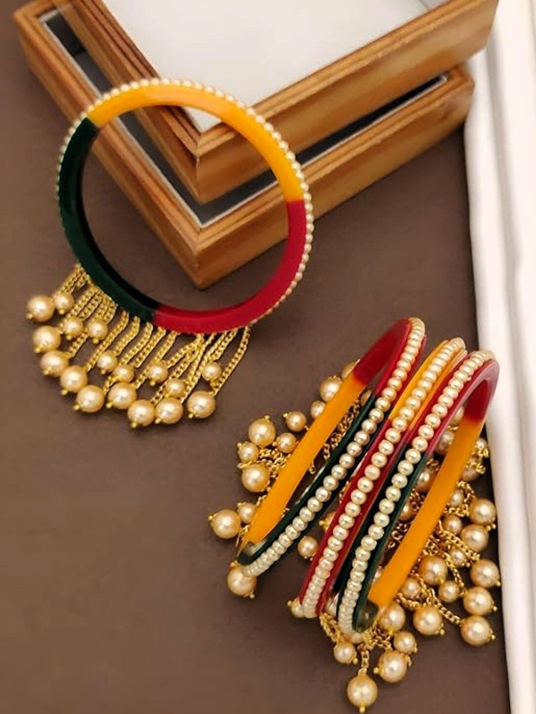 

Zindura Pack Of 4 Gold-Plated Pearls Beaded Bangles