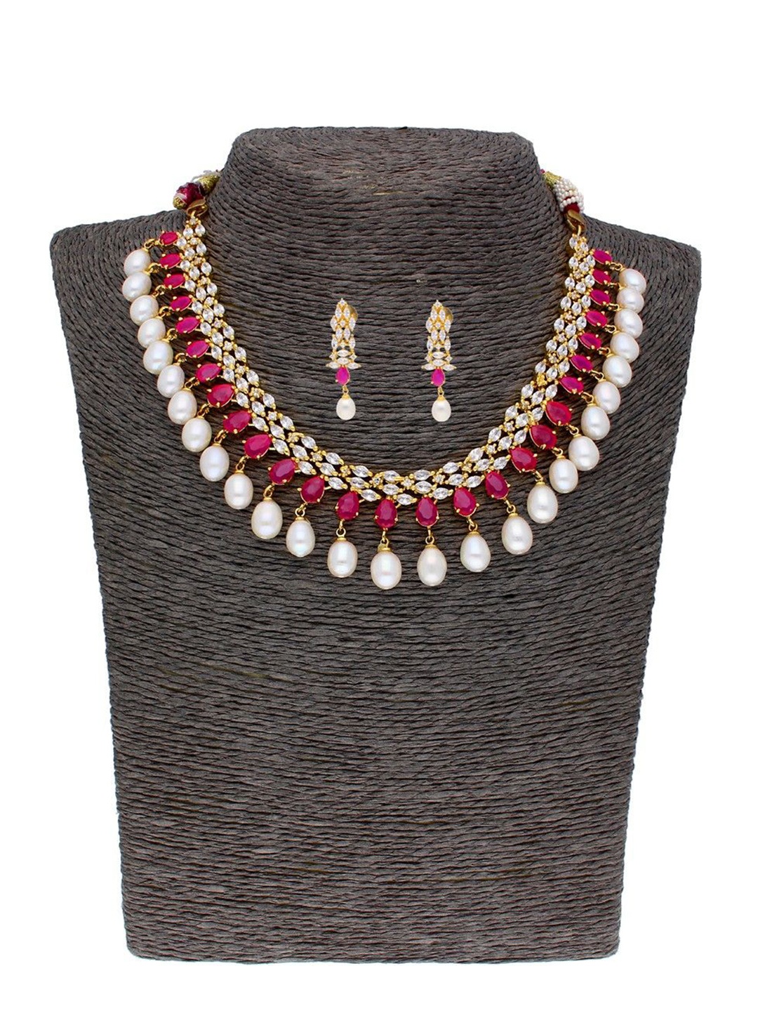 

Sri Jagdamba Pearls Dealer Gold-Plated Stone Studded & Pearls Beaded Jewellery Set