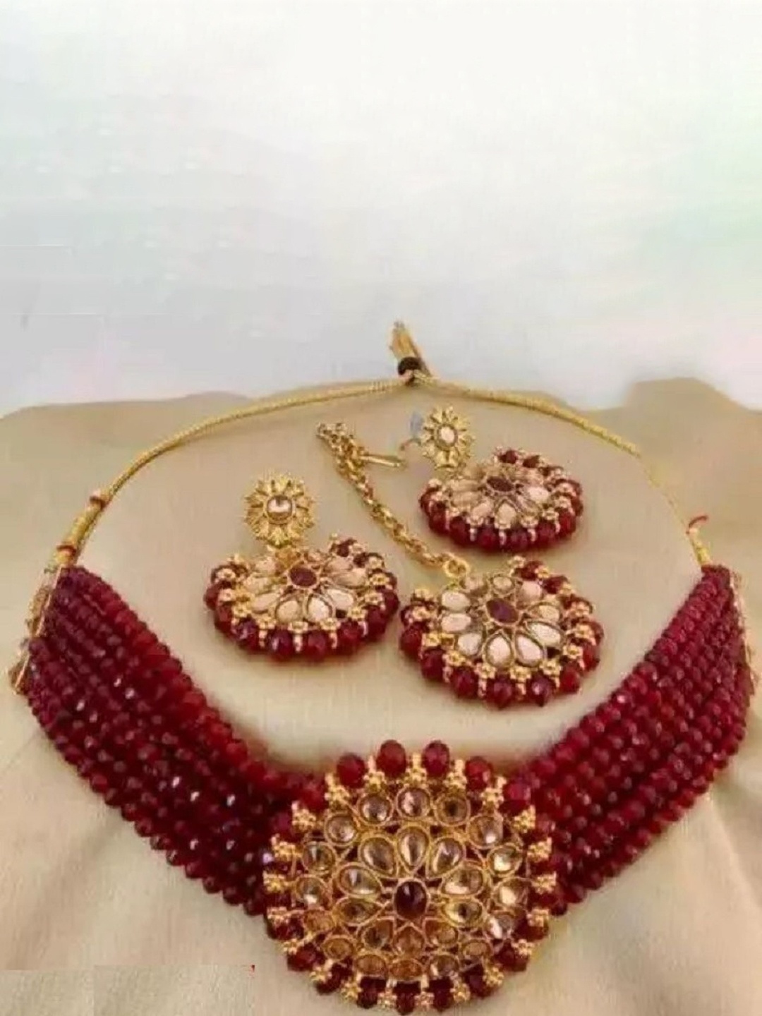 

JMBW INTERNATIONAL Artificial Stones and Beads Studded Necklace with Earrings & Maang Tika, Maroon