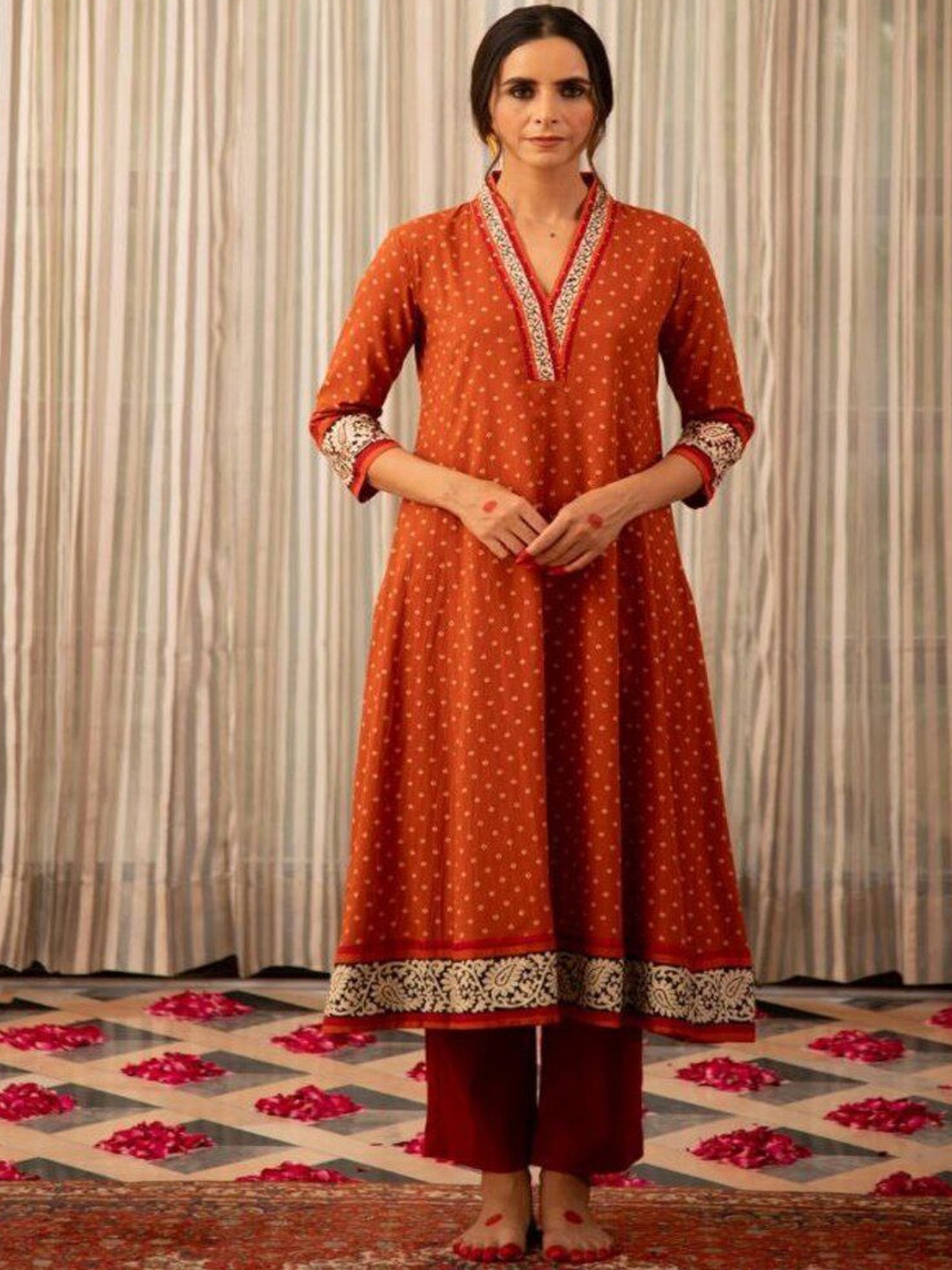 

Modestouze Attires Bandhani Printed V-Neck A-Line Kurta with Trouser, Orange