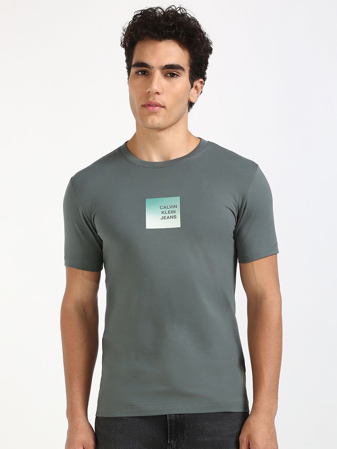 

Calvin Klein Jeans Men Typography Printed Round Neck Cotton T-shirt, Grey