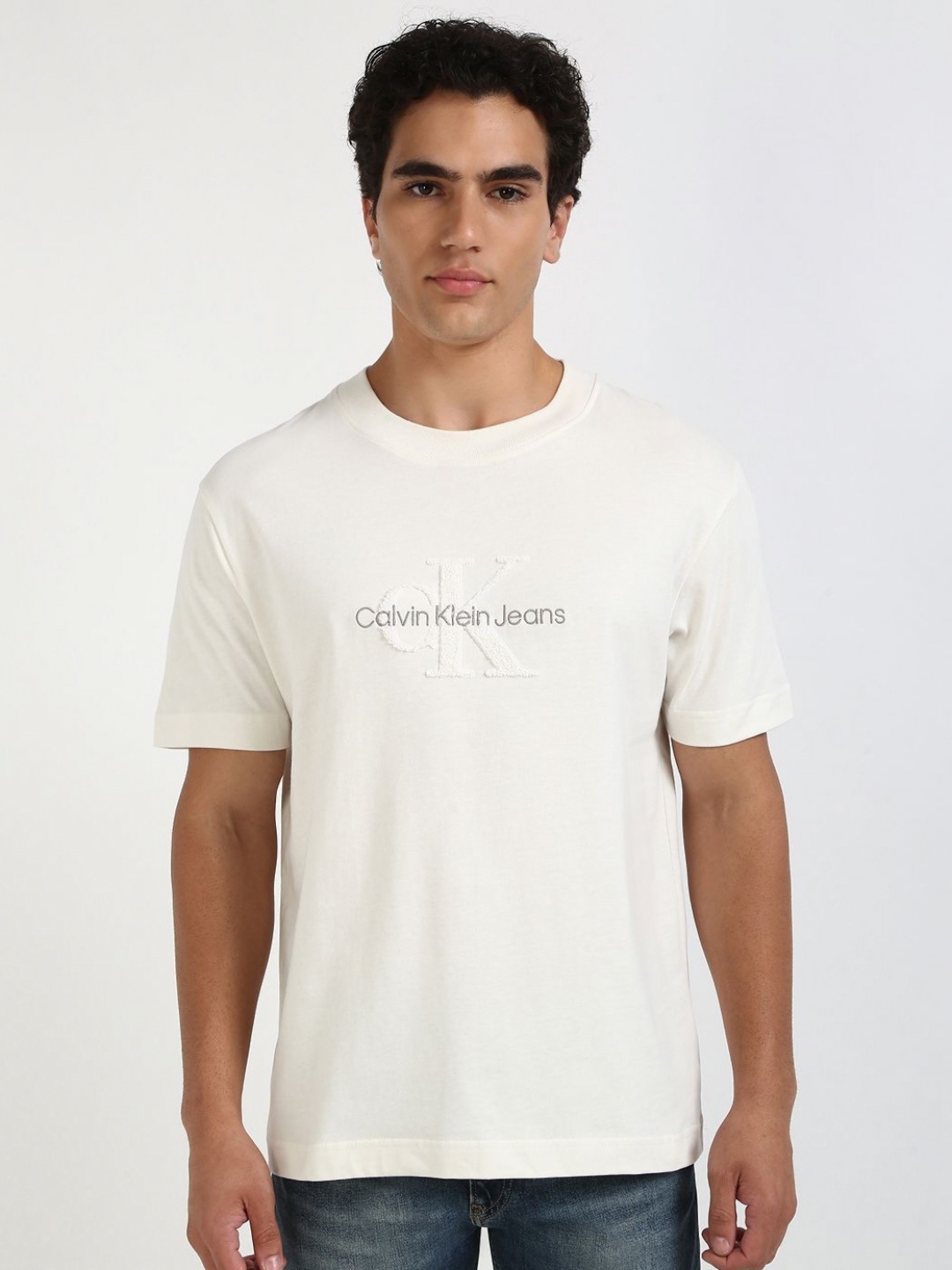 

Calvin Klein Jeans Men Typography Printed Round Neck Cotton T-shirt, White
