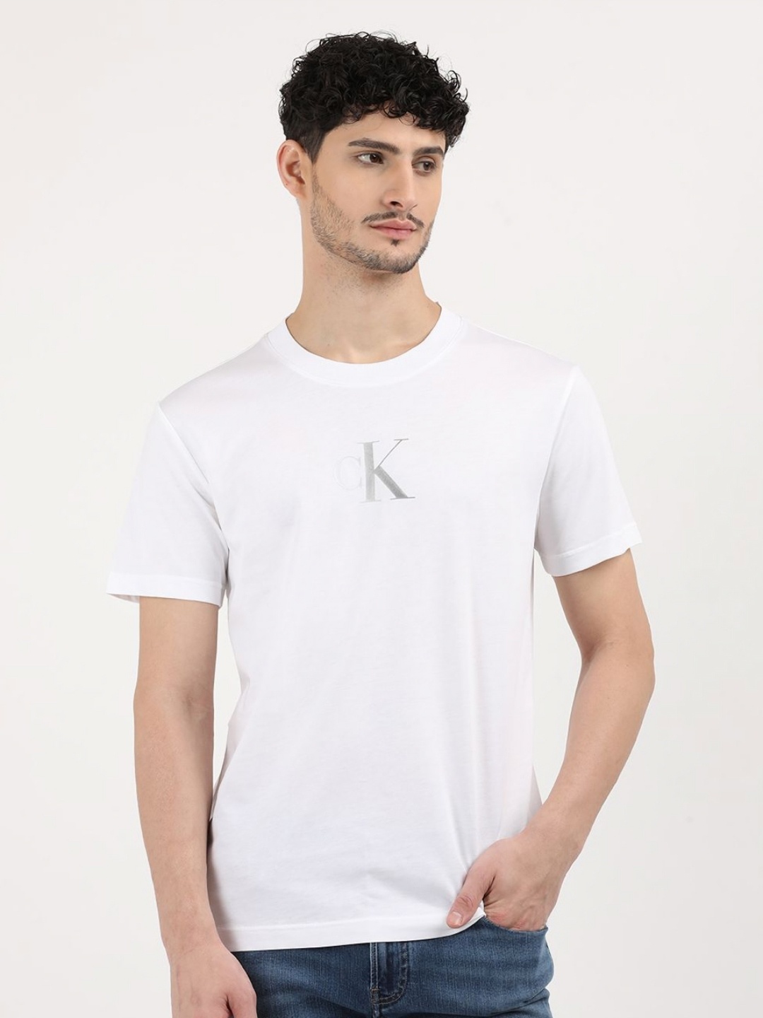 

Calvin Klein Jeans Men Solid Round Neck Cotton T-shirt, White