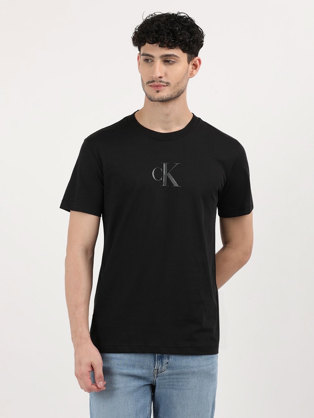 

Calvin Klein Jeans Men Solid Round Neck Cotton T-shirt, Black