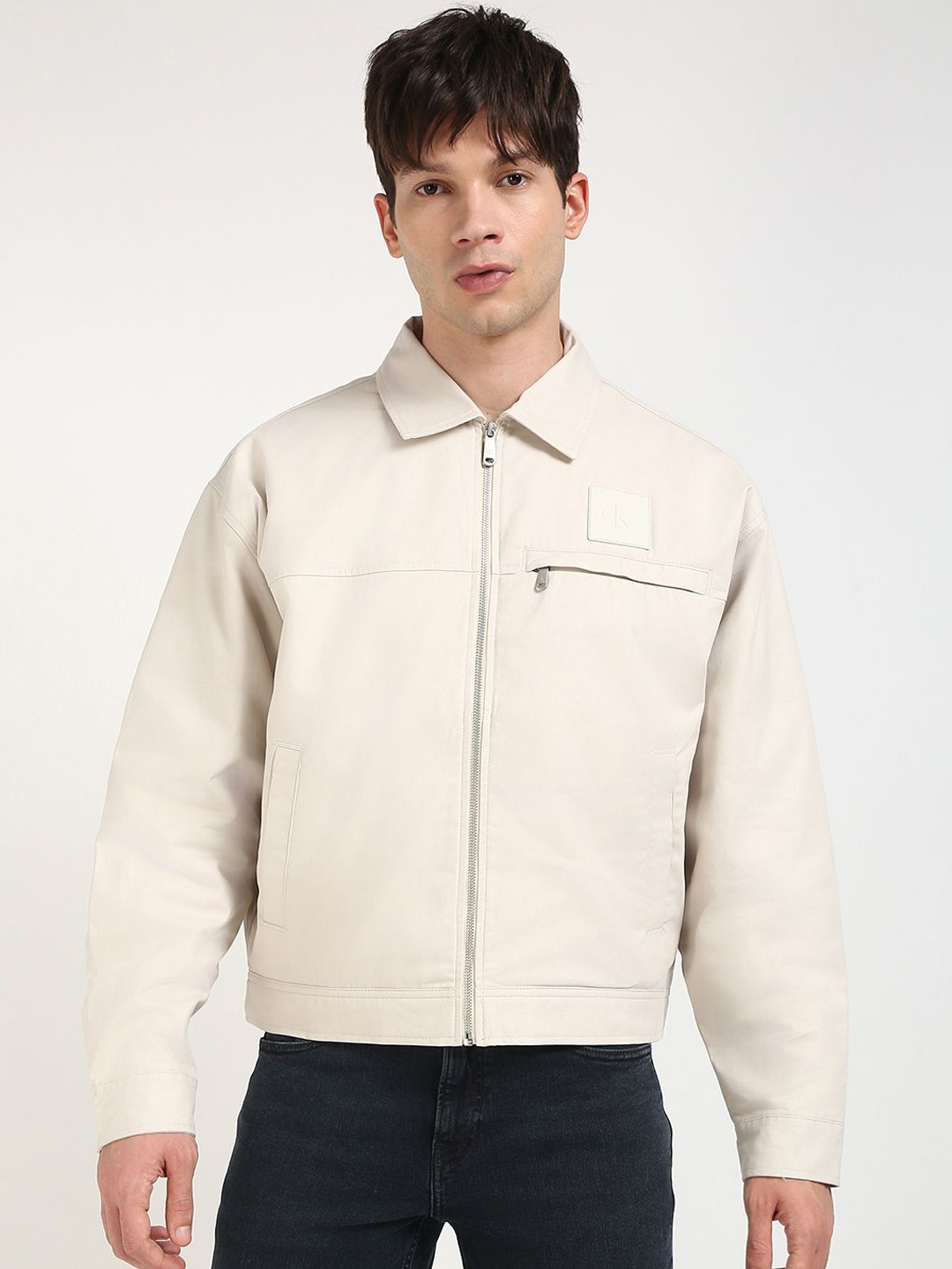 

Calvin Klein Jeans Men Spread Collar Solid Cotton Casual Tailored Jacket, Cream