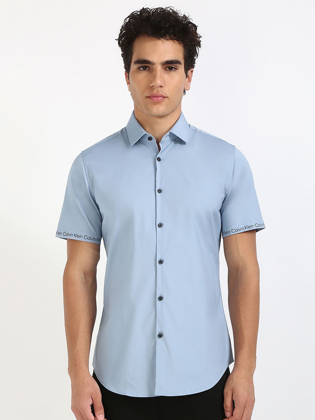 

Calvin Klein Jeans Men Spread Collar Solid Cotton Casual Shirt, Blue