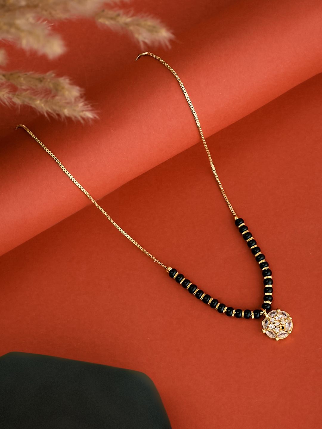 

ATIBELLE Gold-Plated Cubic Zirconia Stone Studded & Beaded Floral Shaped Mangalsutra