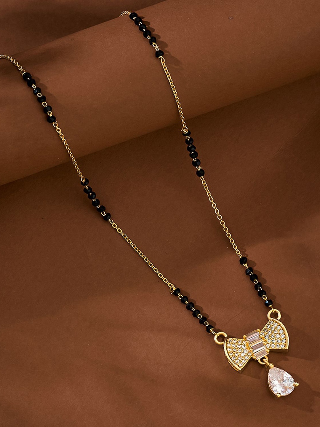 

ATIBELLE Gold-Plated Stone Studded & Beaded Bow Shaped Mangalsutra