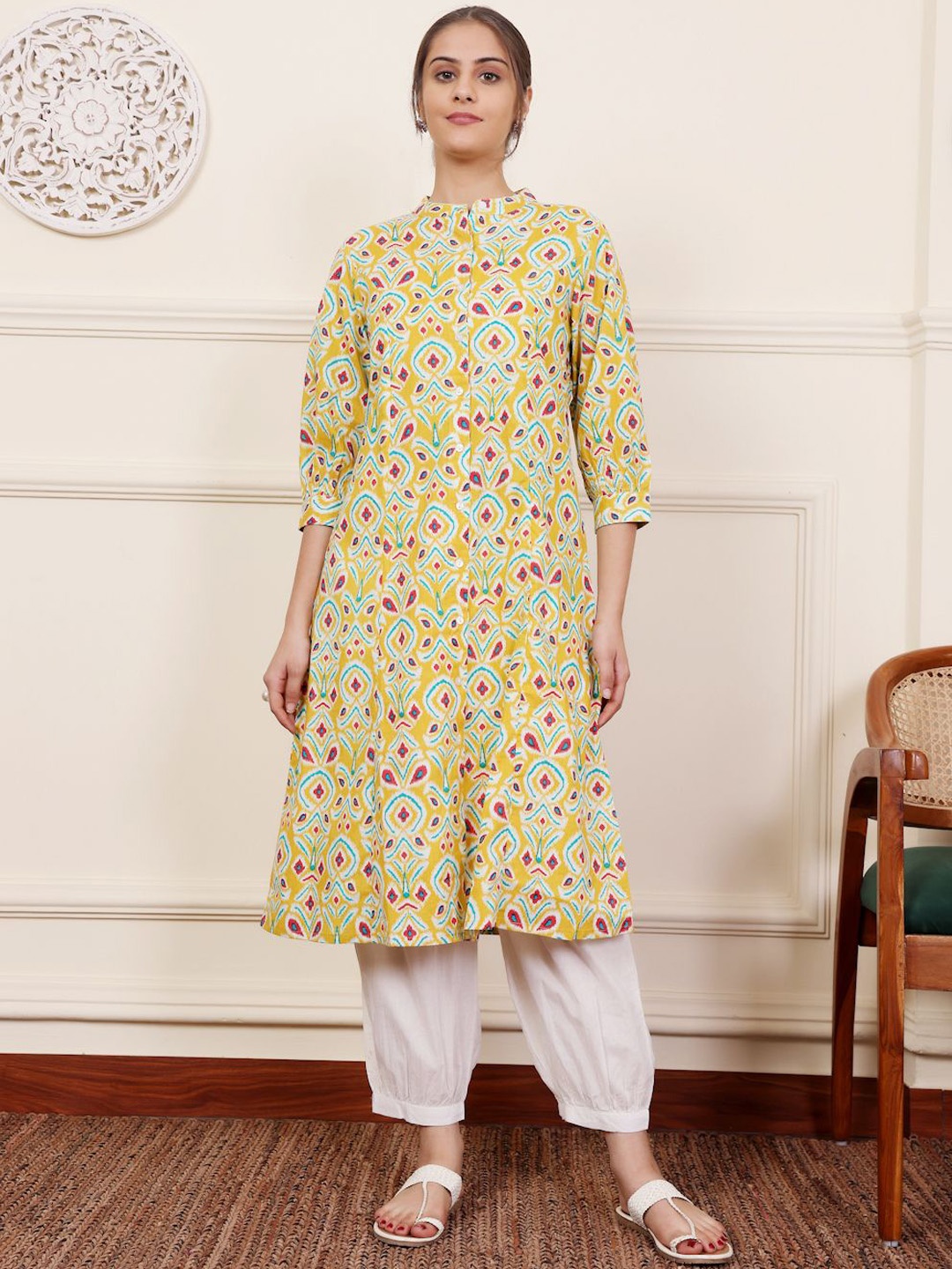 

SAVI Ethnic Motifs Printed Band Collar Puff Sleeves Machine Weave Pure Cotton A-Line Kurta, Yellow