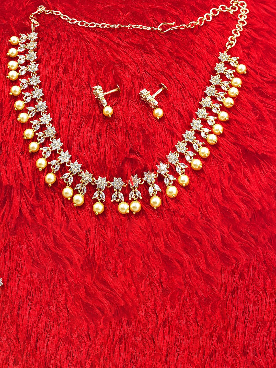 

Anujeet Fashion Hub Gold-Plated Stone-Studded & Beaded Jewellery Set