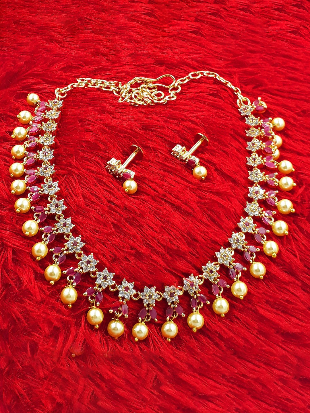 

Anujeet Fashion Hub Gold-Plated Stone-Studded & Beaded Jewellery Set