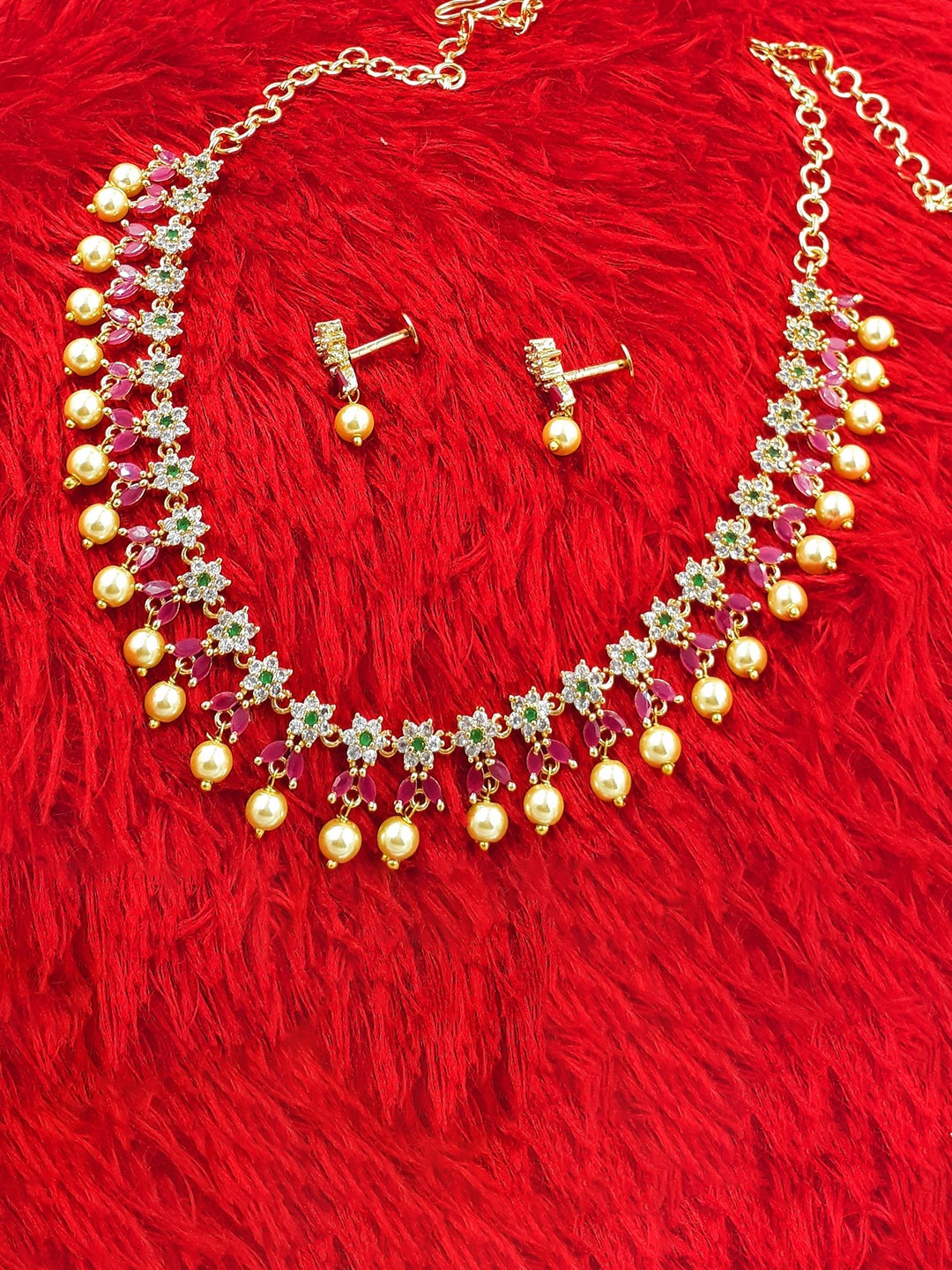 

Anujeet Fashion Hub Gold-Plated Stone-Studded & Beaded Jewellery Set