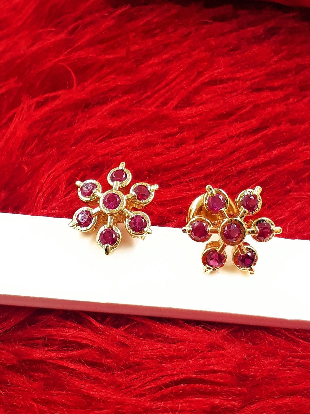 

Anujeet Fashion Hub Gold-Plated American Diamond Studded Floral Studs Earrings