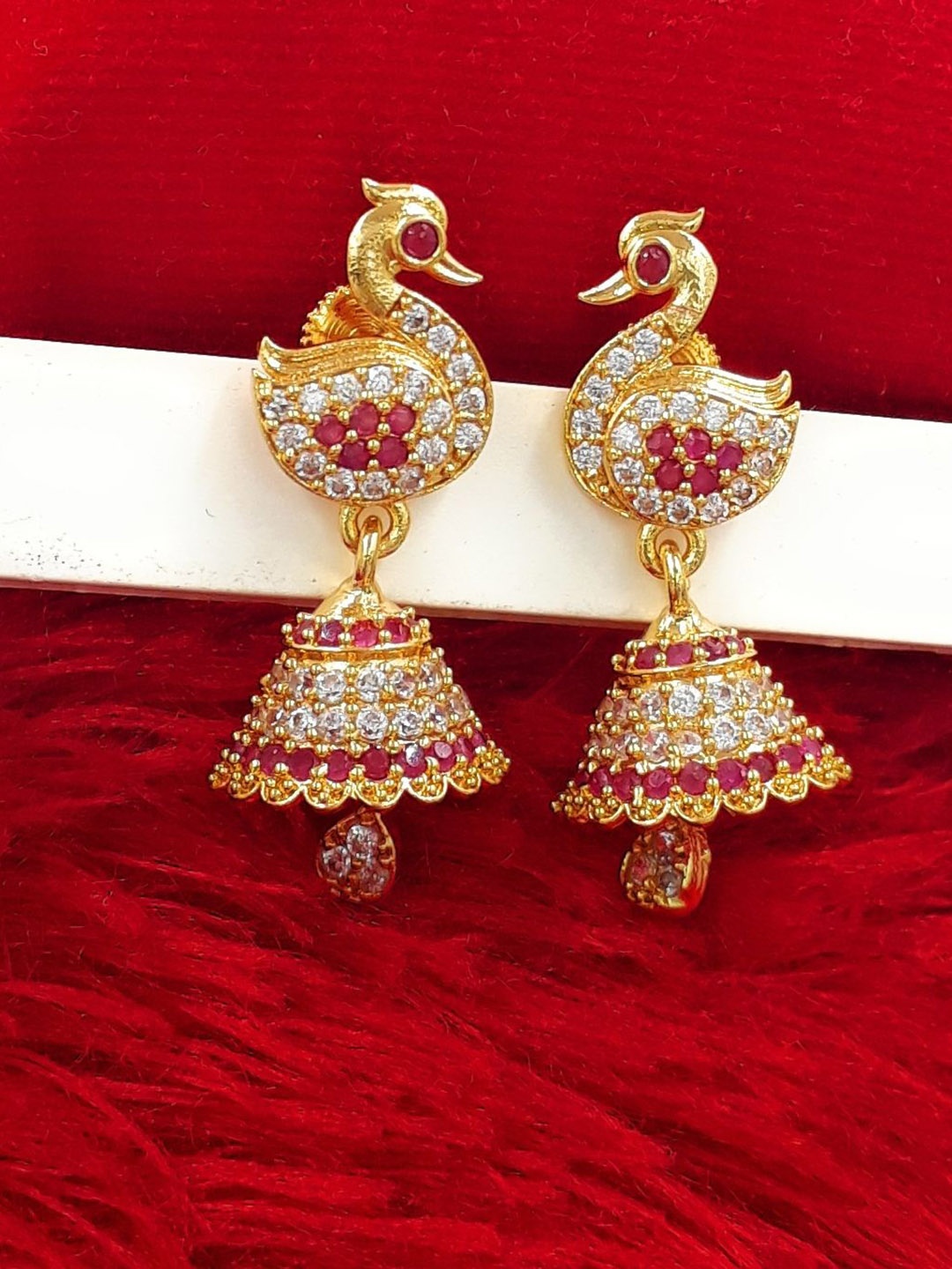 

Anujeet Fashion Hub Gold-Plated American Diamond Studded Contemporary Jhumkas