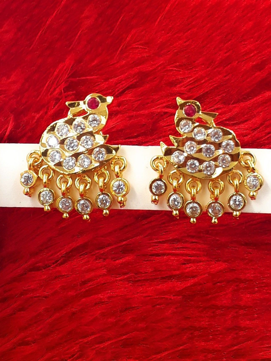 

Anujeet Fashion Hub Gold Plated AD Studded Swan Shaped Studs
