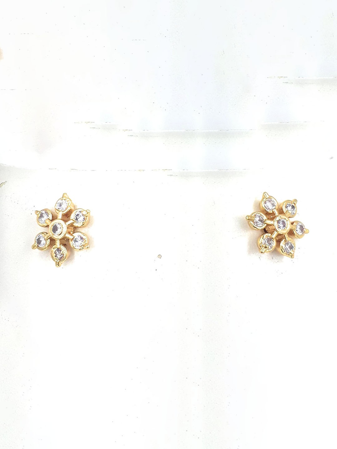 

Anujeet Fashion Hub Gold-Plated American Diamond Studded Floral Studs Earrings