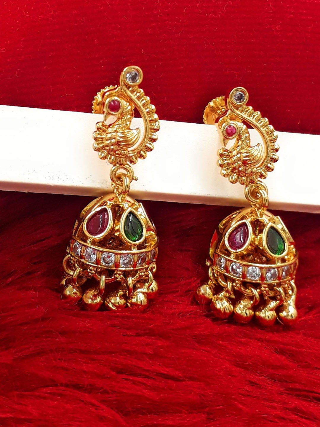 

Anujeet Fashion Hub Gold-Plated American Diamond Studded Peacock Shaped Jhumkas
