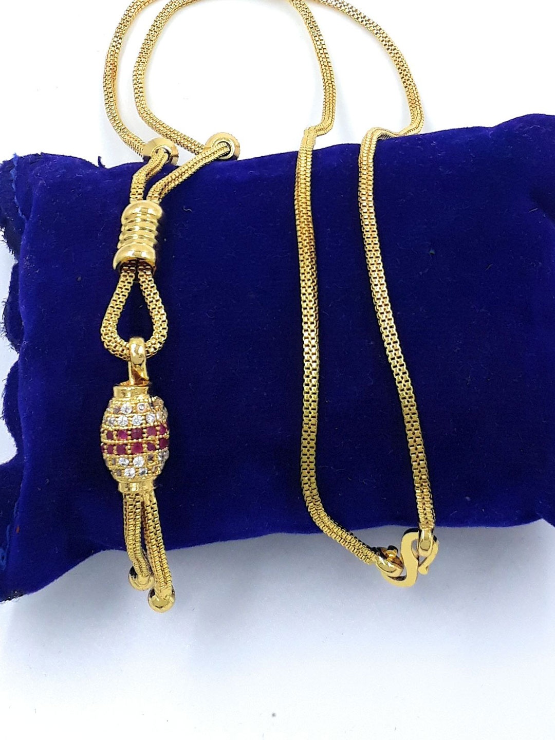 

Anujeet Fashion Hub Gold-Plated AD Studded Ball Dollar Necklace