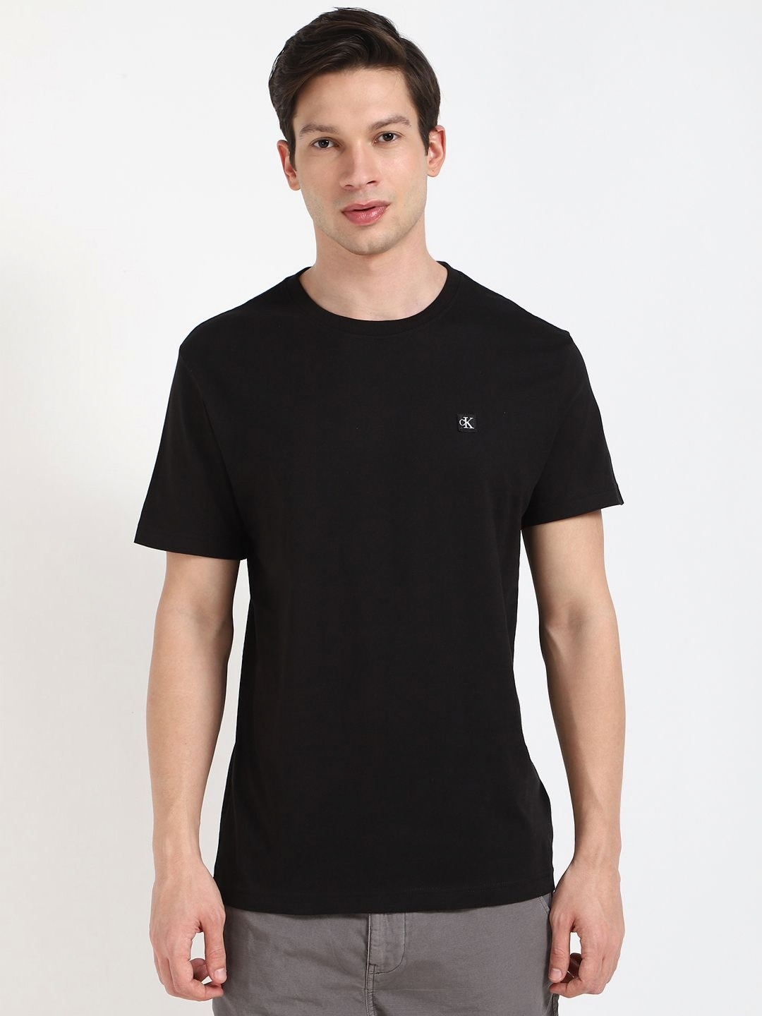 

Calvin Klein Jeans Men Solid Round Neck Cotton T-shirt, Black
