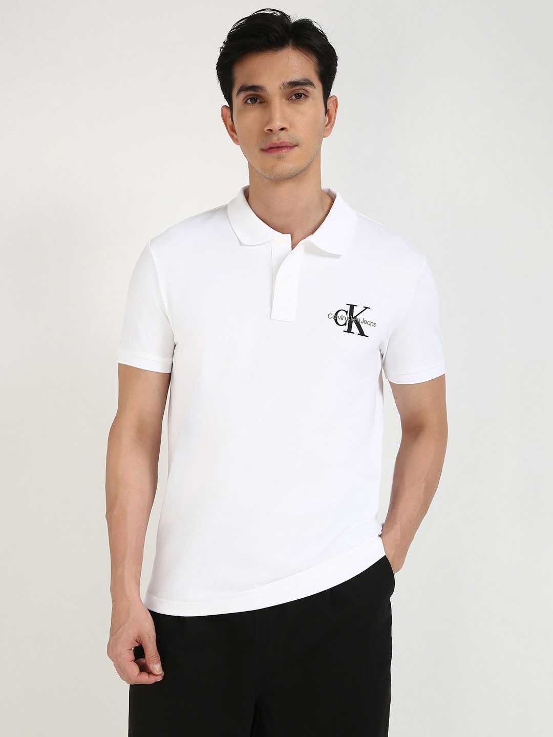 

Calvin Klein Jeans Men Solid Polo Collar Cotton T-shirt, White